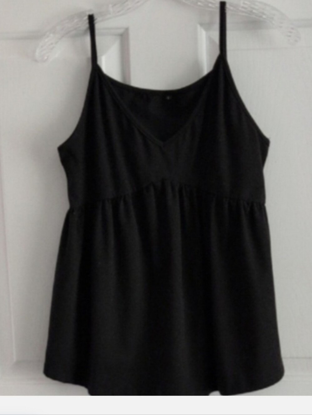 Black knit tank thin spaghetti straps. Flared empire waist silhouett Festival